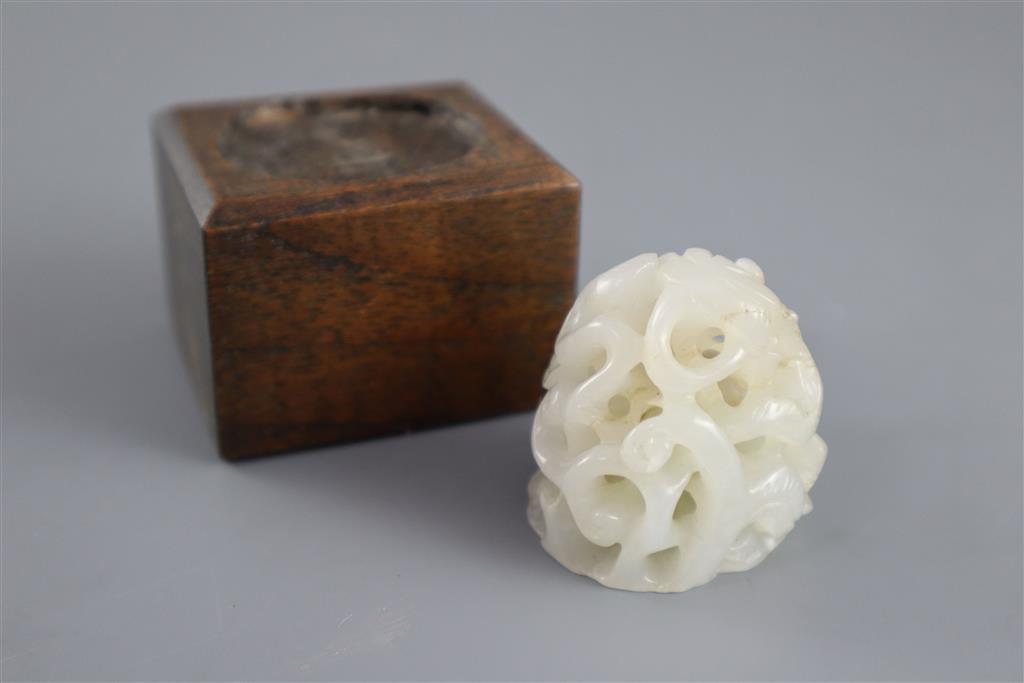 A Chinese white jade hat finial, 3.8cm high, later wood stand